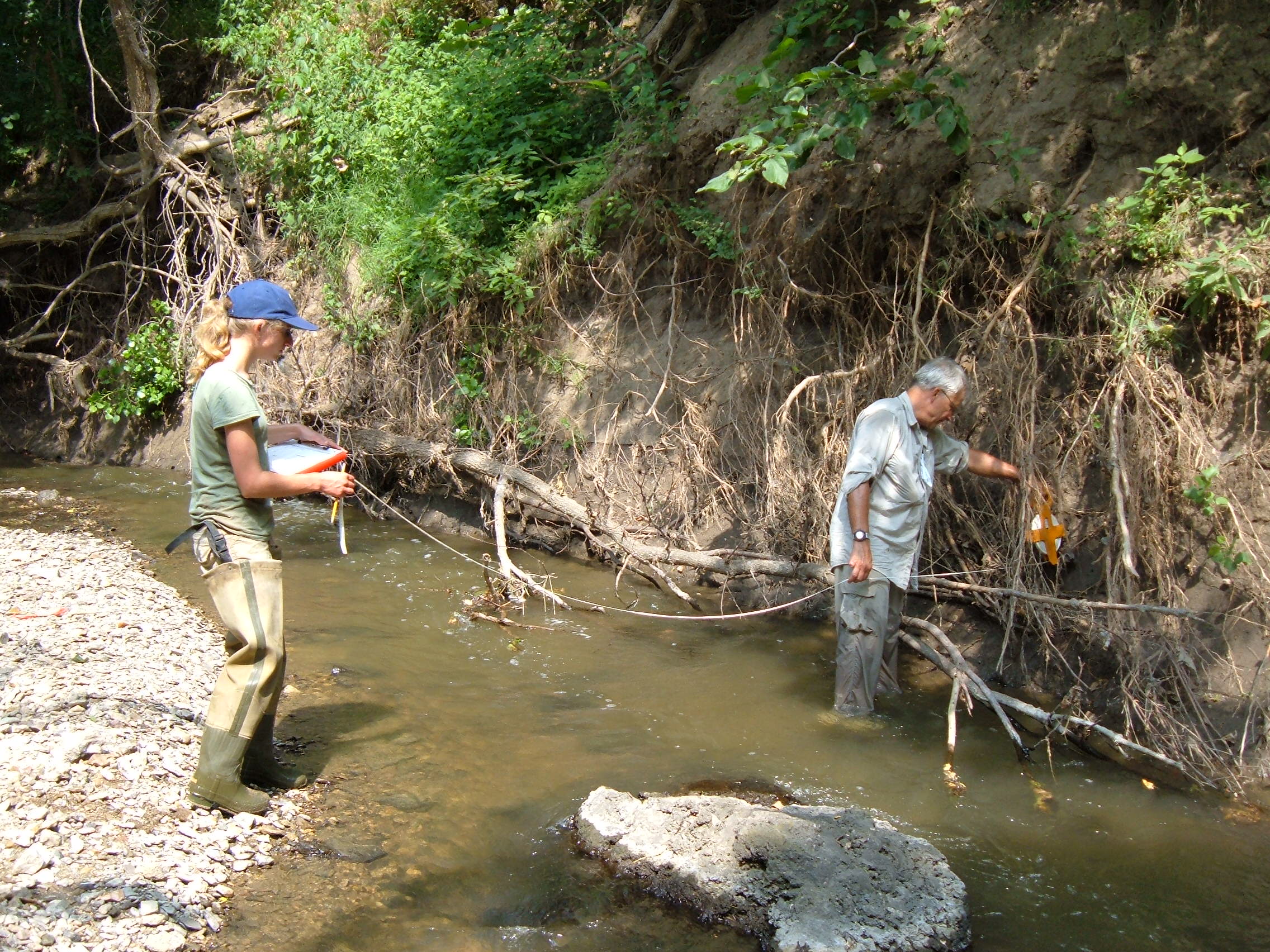 Measuring the wetted width of Lost Creek in 2008.