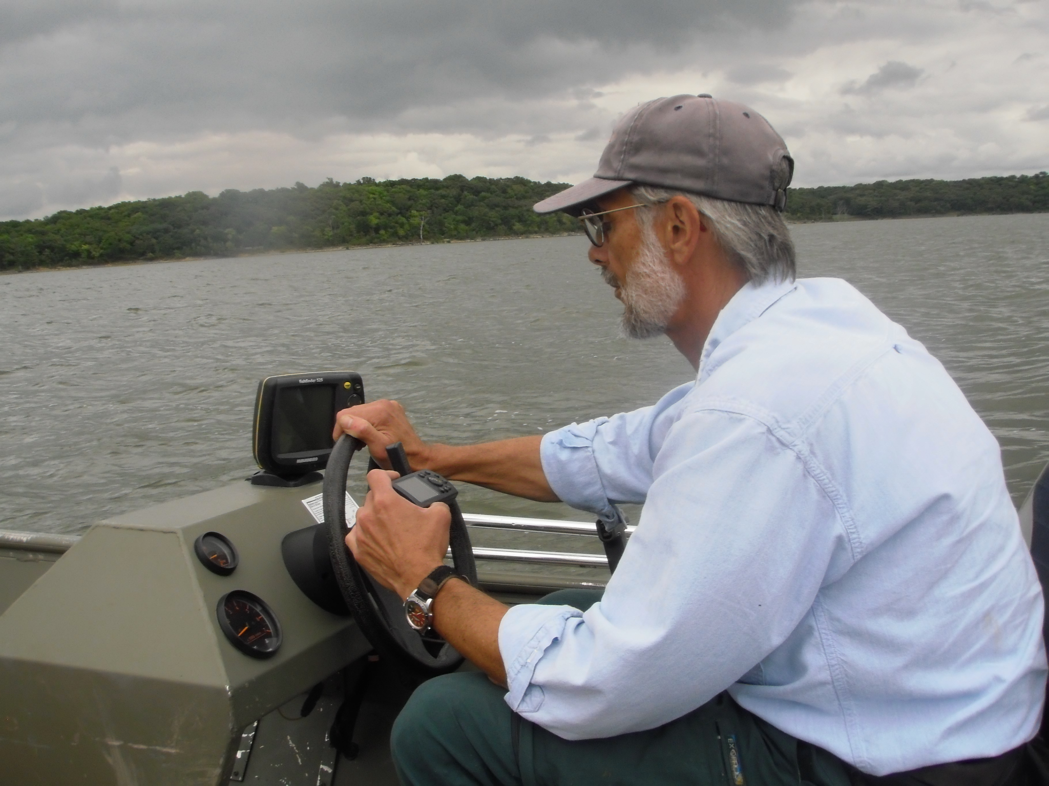 Paul Liechti driving the boat on Clinton Lake in 2009.