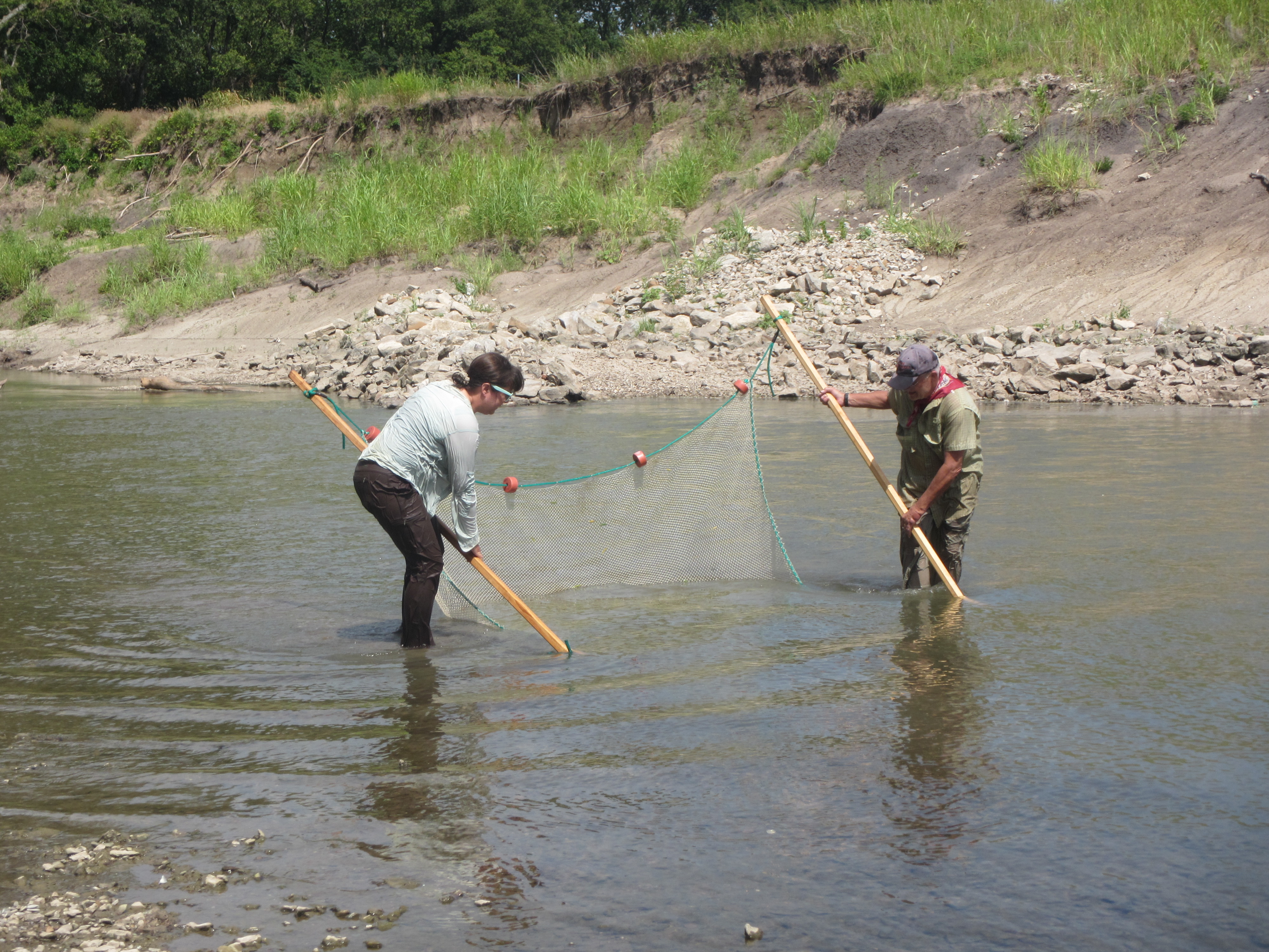 Debbie Baker and Dr. Don Huggins seine fish on the Cottonwood River.