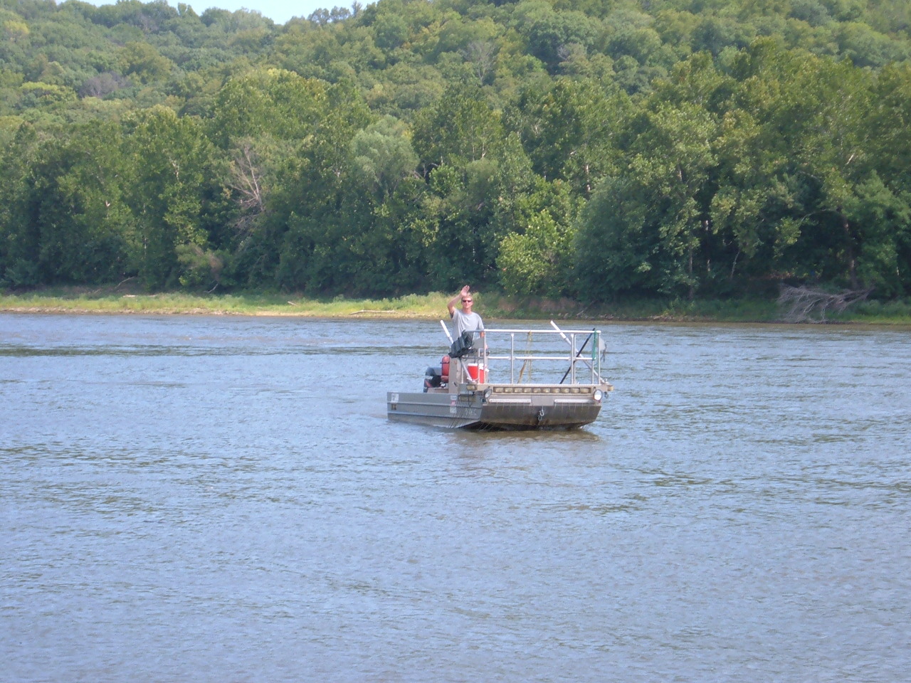Alex Bartlett drives the electrofishing boat on the Missouri River.