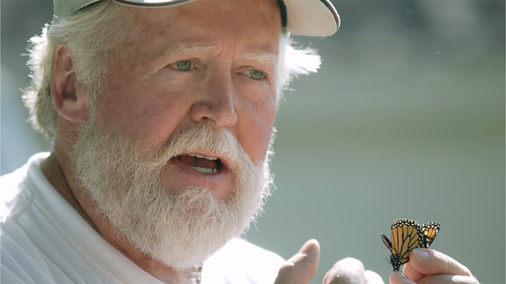 Chip Taylor holding monarch butterfly